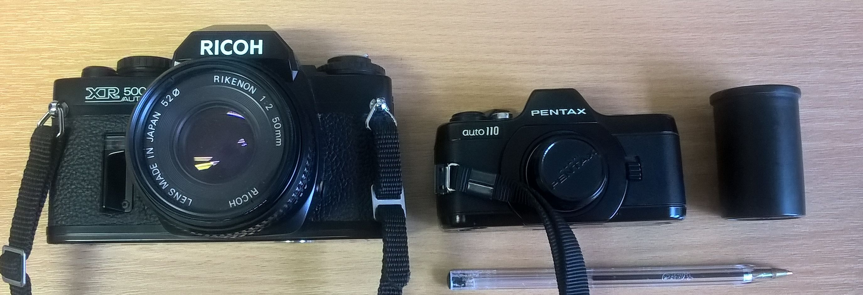 Pentax Auto 110 SLR in comparison with a Ricoh 35mm SLR