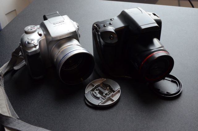 Fujifilm Finepix  S3000 beside no name 16MP camera