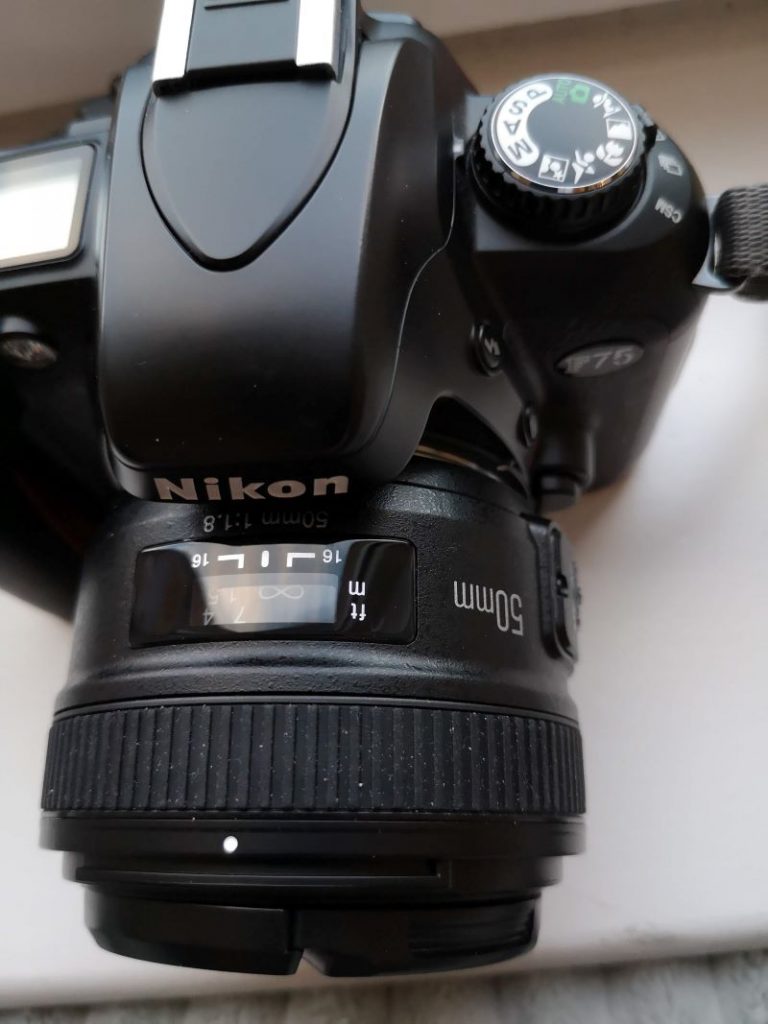 You'll be able to use the Yongnuo on this Nikon F75 but it's one of  few models that will full support the lens