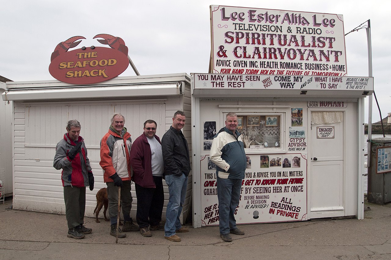 They really were queueing to see the clairvoyant. "We need to know if we'll make it through the weekend." said one.
